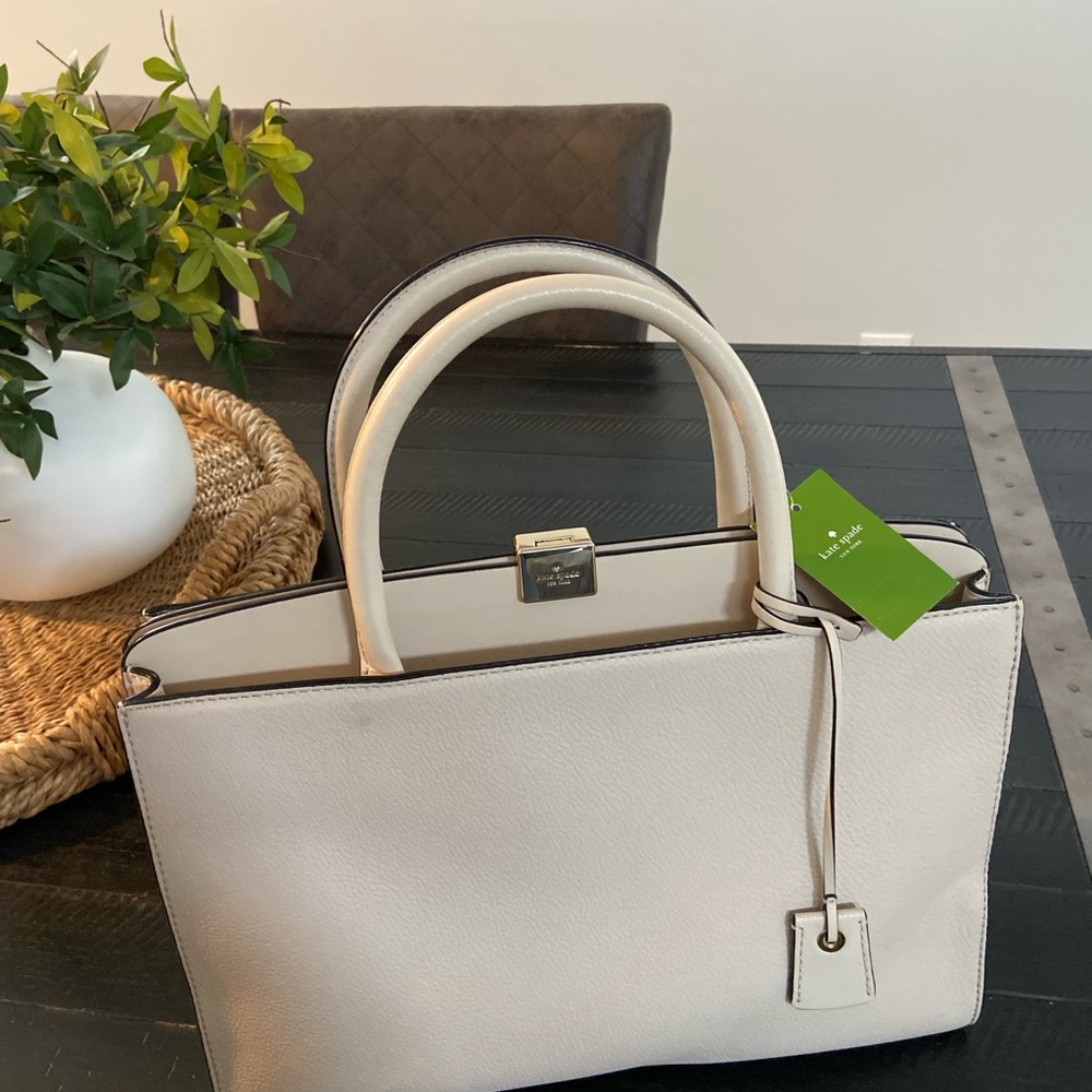 brand new with tags Kate Spade leather. Roomy Henley bag $429 original price.